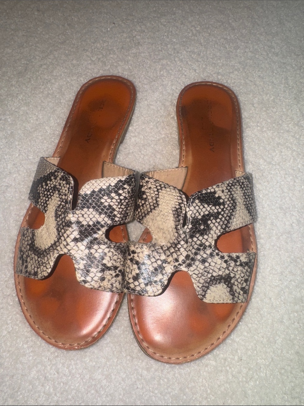 Rockport Snake-Embossed Slide Sandals in Black and Cream